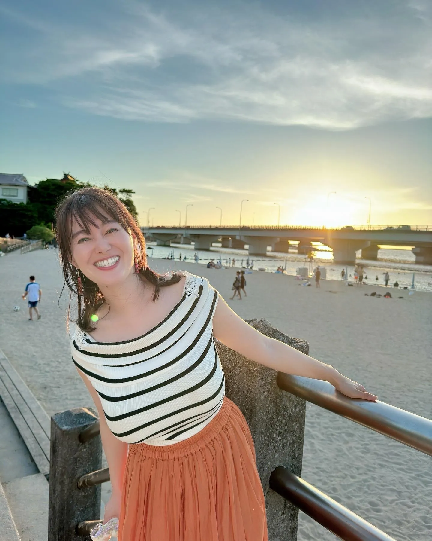 striped top at the beach