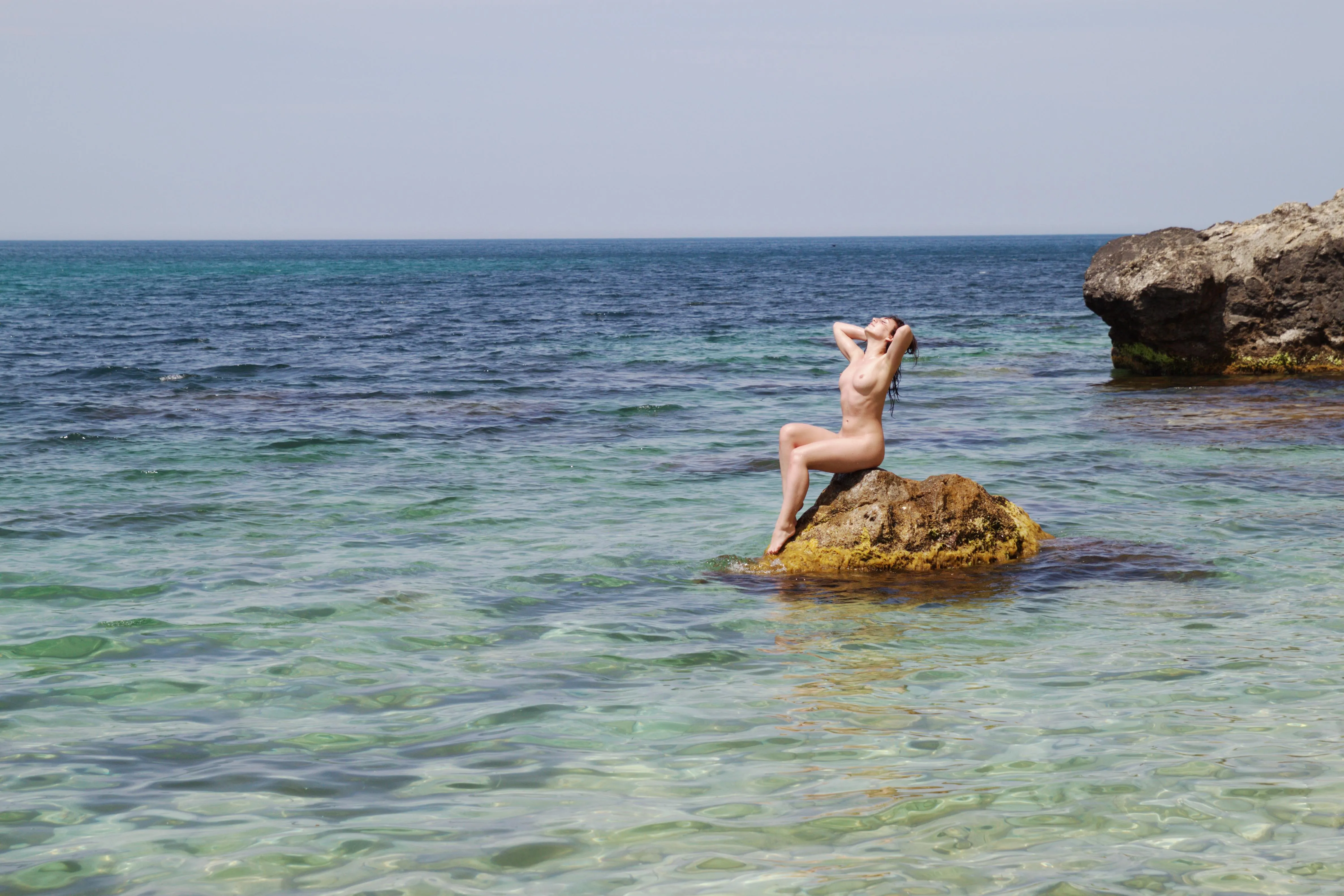 Meeting on the seashore with a naked mermaid