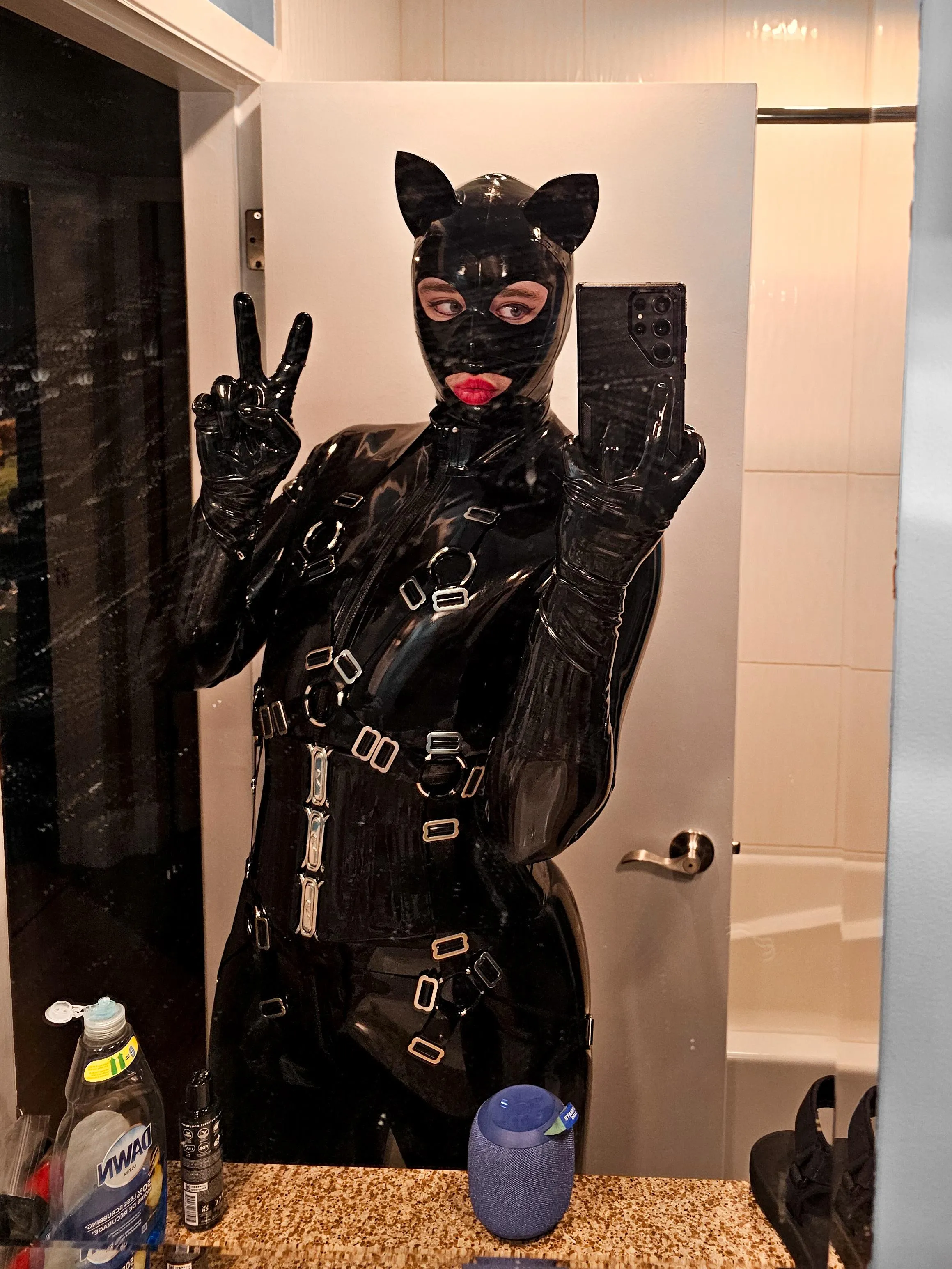 A rubber kitty preparing for some fun